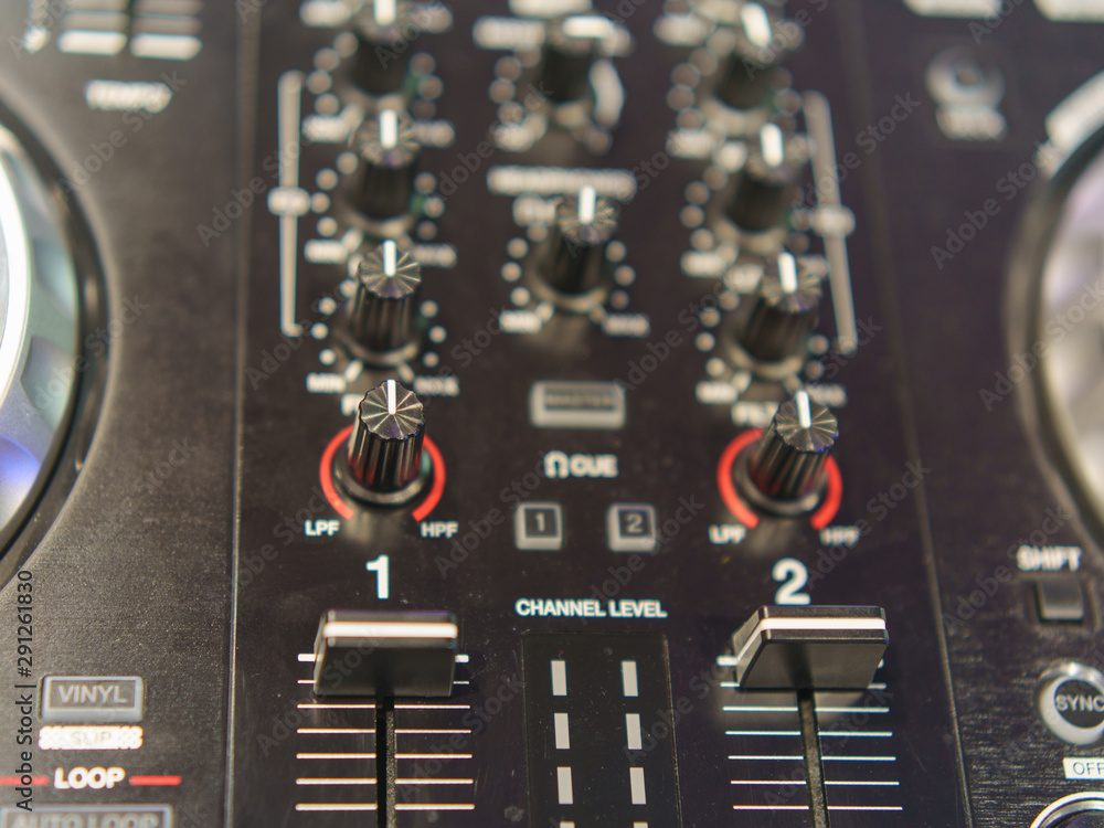 Photography of the modern premium dj remote. Design of professional musical equipment. Close frontal view. Photography of the modern premium dj remote. Design of professional musical equipment. Close frontal view.