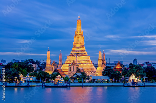 Arun Worawihan Temple Located on the Chao Phraya River, Thailand. At night the light illuminates the beautiful water.