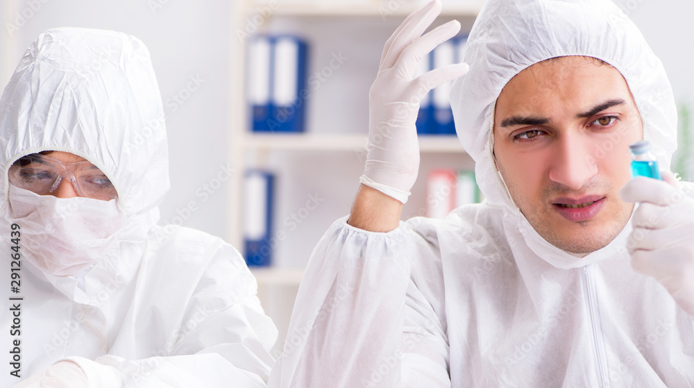 Two chemists working in the lab Two chemists working in the lab