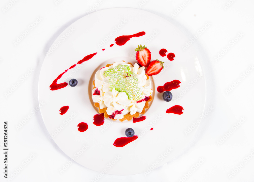 Tartlet with cream decorated with berry fruit Tartlet with cream decorated with berry fruit