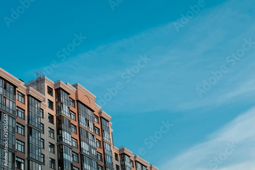 Premium house with sunlit facade and blue sky