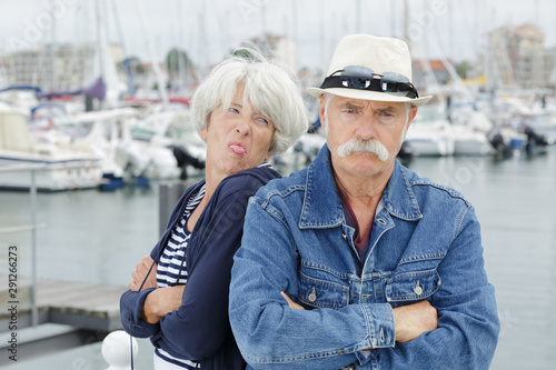 an irritated mature couple outdoors