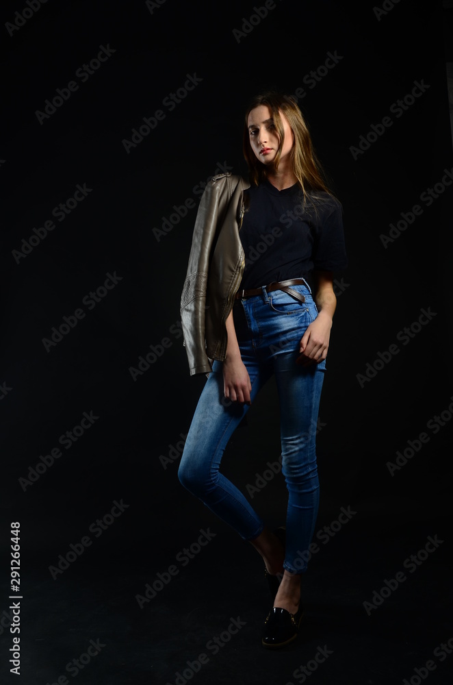 beautiful brunette in the studio on a black background beautiful brunette in the studio on a black background