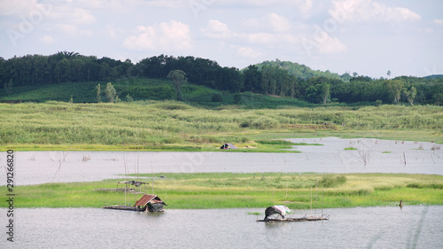  Landscape of Thailand countryside .Hut of fisherman in lake on mountain 