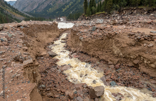 Riverbed after mudflow in the mountains; natural disasters concept