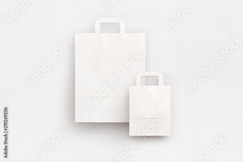 medium and small white kraft paper bags