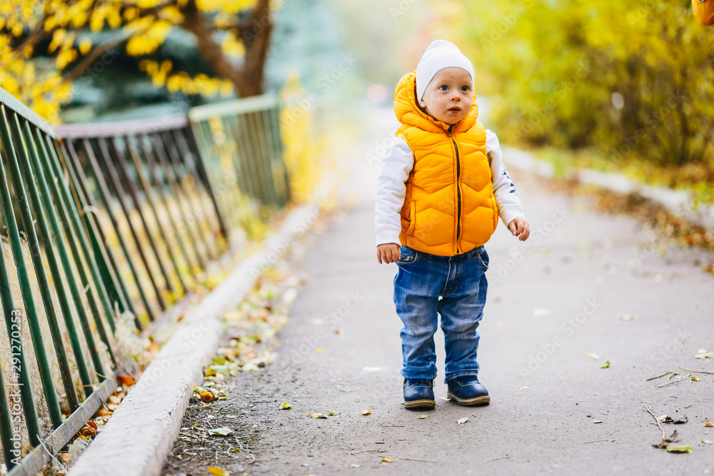 two-year-old child in yellow vest two-year-old child in yellow vest