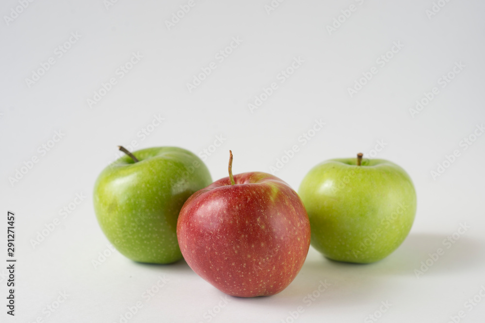 red and green apples with slices and leaves isolated on white background top view. Set or collection. Flat lay pattern red and green apples with slices and leaves isolated on white background top view. Set or collection. Flat lay pattern