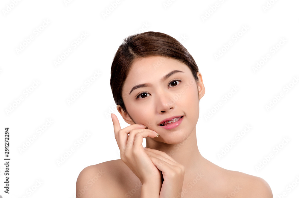 Short hair asian young beautiful woman smiling and touching her face, isolated over white background. natural makeup, SPA therapy, skincare, cosmetology and plastic surgery concept Short hair asian young beautiful woman smiling and touching her face, isolated over white background. natural makeup, SPA therapy, skincare, cosmetology and plastic surgery concept