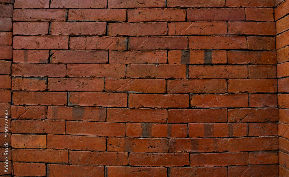 Obraz premium Ancient brick wall pattern, for background, textured wallpaper, or design concepts.