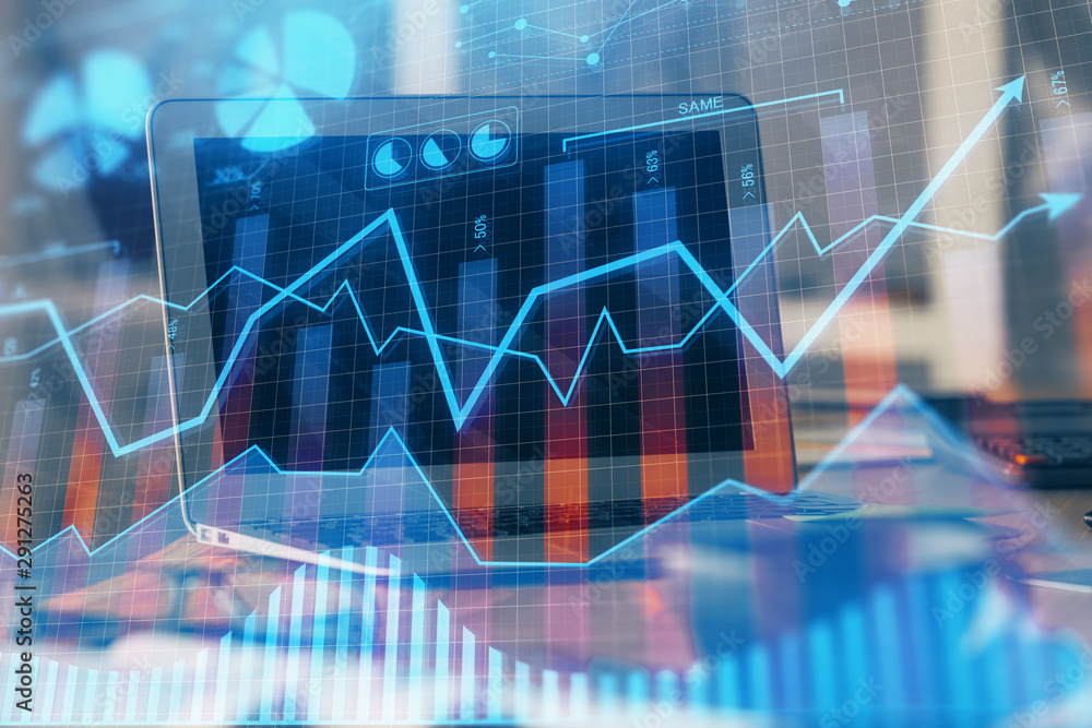 Forex market graph hologram and personal computer on background. Multi exposure. Concept of investment. Forex market graph hologram and personal computer on background. Multi exposure. Concept of investment.