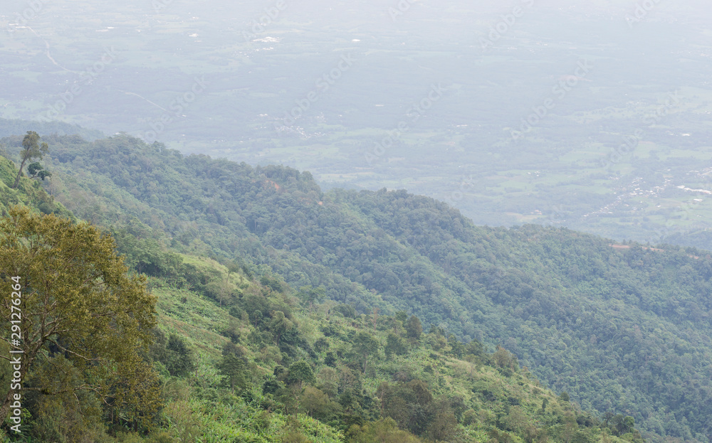 Landscape view on the shadow mountain foggy defocused blur background