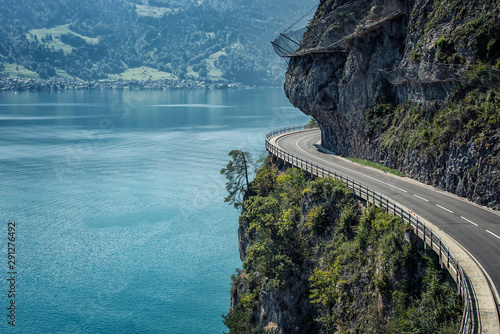 Road built in the cliff in Switzerland photo