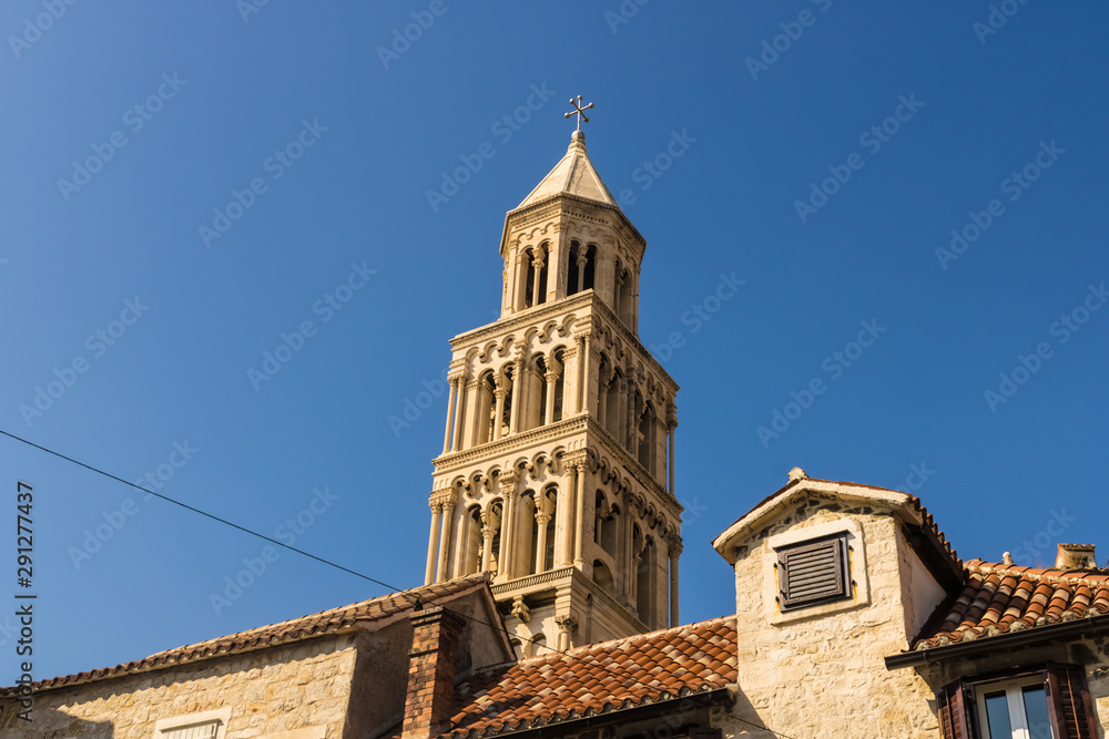 Bell tower on the top of Cathedral of Saint Domnius with the blue sky and houses, Split, Croatia - Image