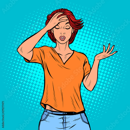 A young woman holds his hand to his head. Headache