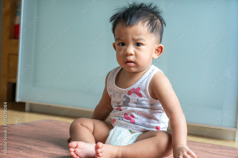 Adorable toddler child boy sitting in room Adorable toddler child boy sitting in room