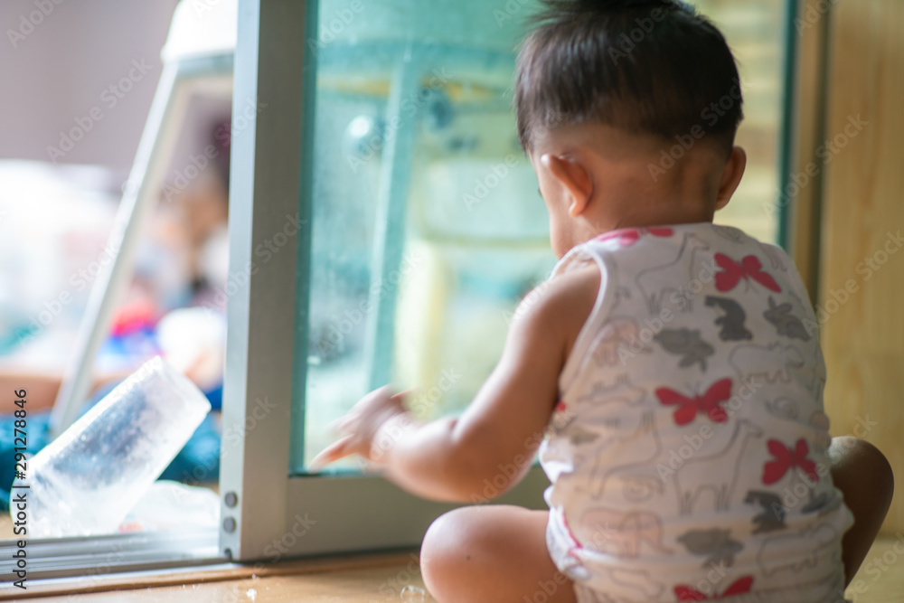Adorable toddler child boy sitting in room Adorable toddler child boy sitting in room