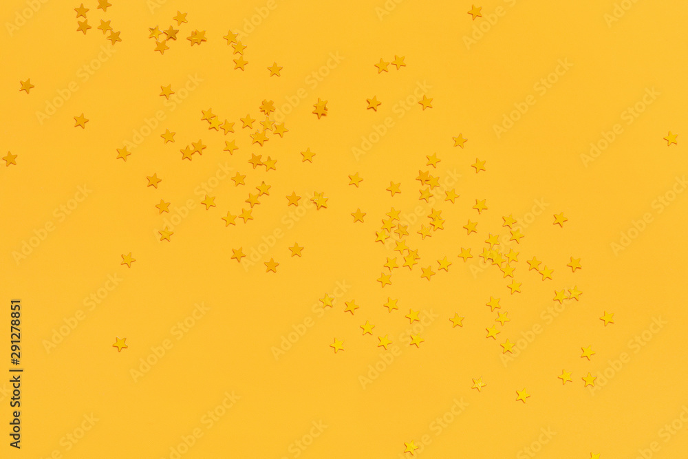 Golden stars on the vibrant yellow background