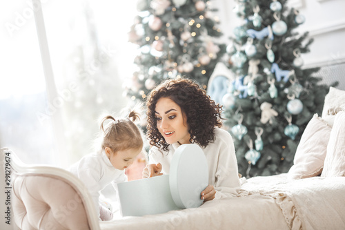 Cheerful family having fun near the christmas tree