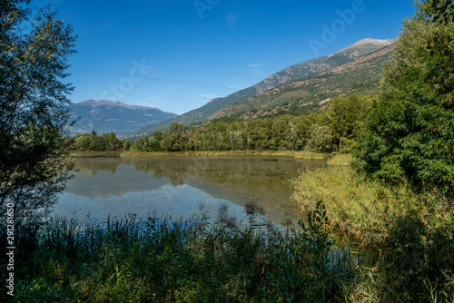 mountain panorama with blue lake in the last days of summer