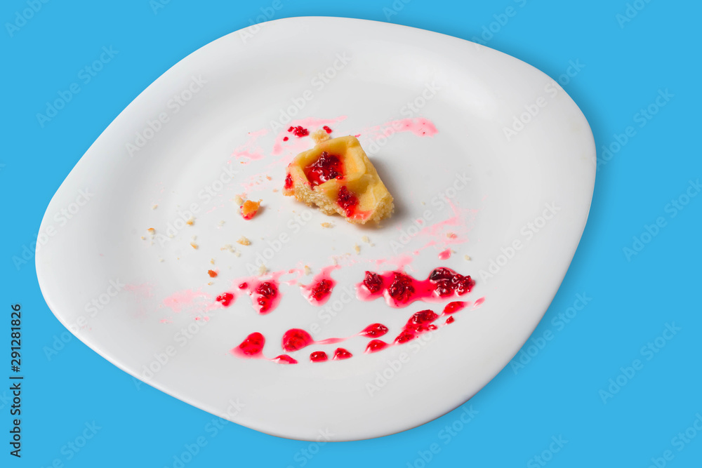 Belgian waffle with raspberry jam on a blue background. copy space Belgian waffle with raspberry jam on a blue background. copy space