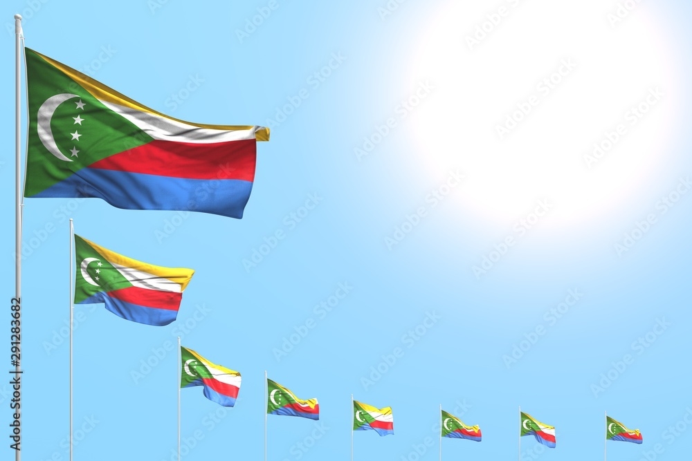 cute day of flag 3d illustration. - many Comoros flags placed diagonal on blue sky with space for your text cute day of flag 3d illustration. - many Comoros flags placed diagonal on blue sky with space for your text