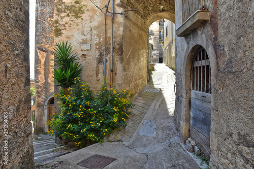 A narrow street between old buildings in the medieval town of Alvito, in the Lazio region of Italy photo