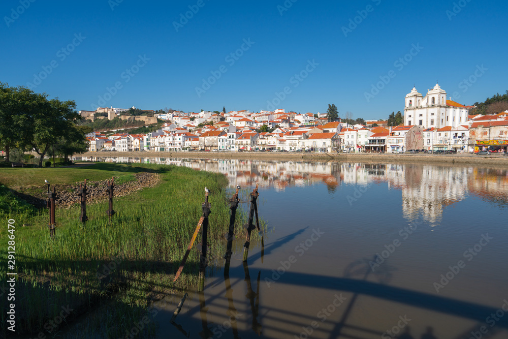 Fototapeta premium View of Alcacer do Sal cityscape from the other side of the Sado river