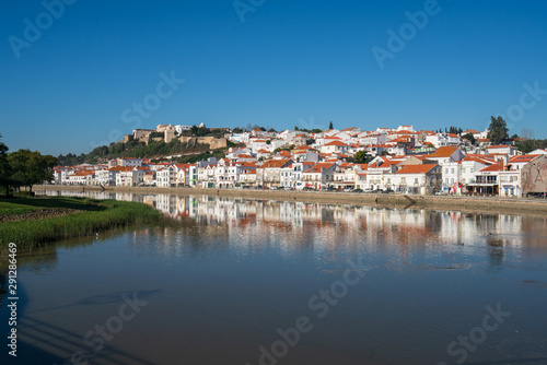 View of Alcacer do Sal cityscape from the other side of the Sado river © Luis