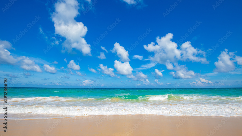 Sea wave on summer white beach with cloud sky