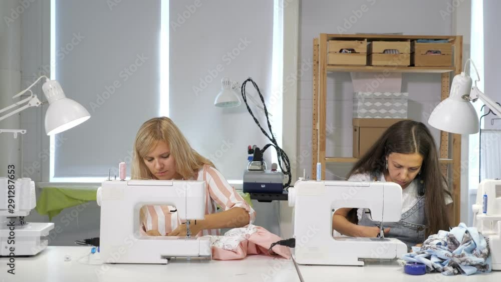 Tailoring of clothes. Seamstresses at work in sewing clothes