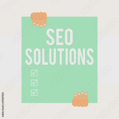 Writing note showing Seo Solutions. Business concept for Search Engine Result Page Increase Visitors by Rankings Two hands holding big blank rectangle up down Geometrical background photo