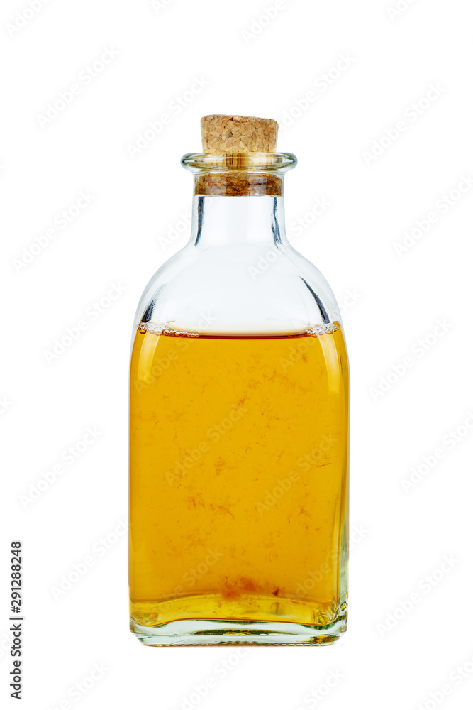 Decanter with apple vinegar isolated on the white background