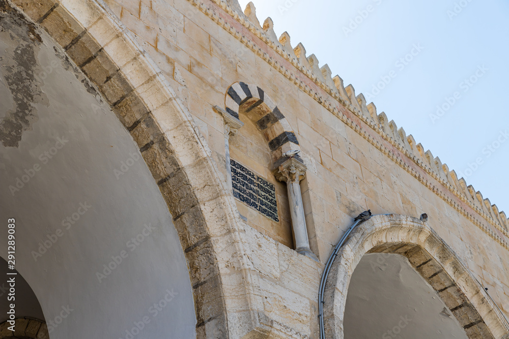 Suran from the Koran above the entrance to the Al Aqsa Mosque on the territory of the interior of the Temple Mount in the Old City in Jerusalem, Israel