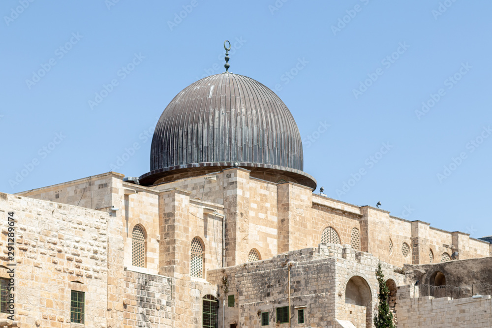 Fototapeta premium Part of the wall of the temple mountain and the dome of the Al Aqsa Mosque near the Dung Gate in the Old City in Jerusalem, Israel