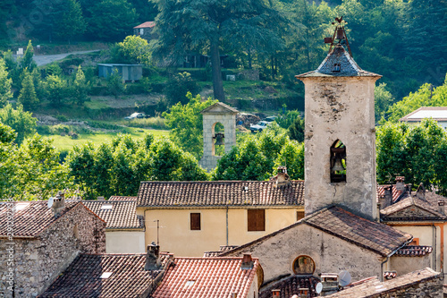 A view of the village of Aulas and the bell tower of his church photo