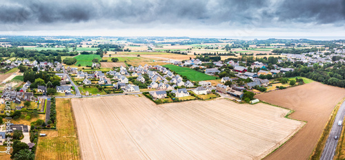 Aerial view of agricultural field and small town at Cancale, France