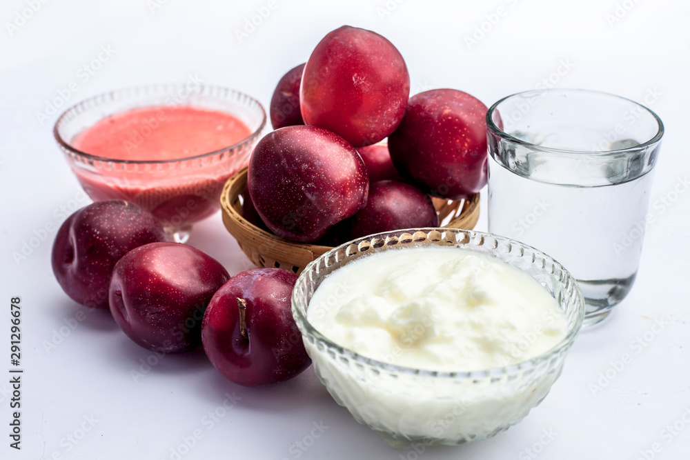 Fresh ripe plum along with its face mask consisting of some plum
