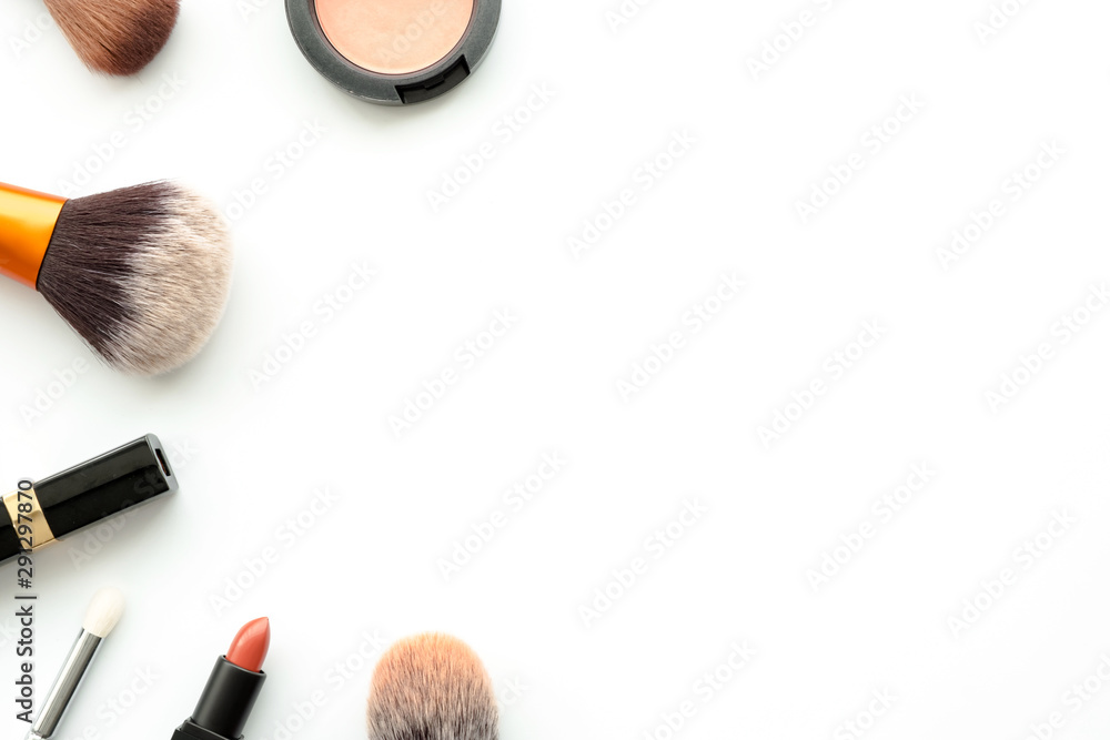 Flat lay image of beauty cosmetics make up with lipsticks, blush on, powder and brushes on white background. Top view with copy space, for your text. Flat lay image of beauty cosmetics make up with lipsticks, blush on, powder and brushes on white background. Top view with copy space, for your text.