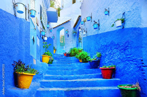 Moroccan architecture in Chefchaouen blue city medina in Morocco with blue walls © Andrii Vergeles