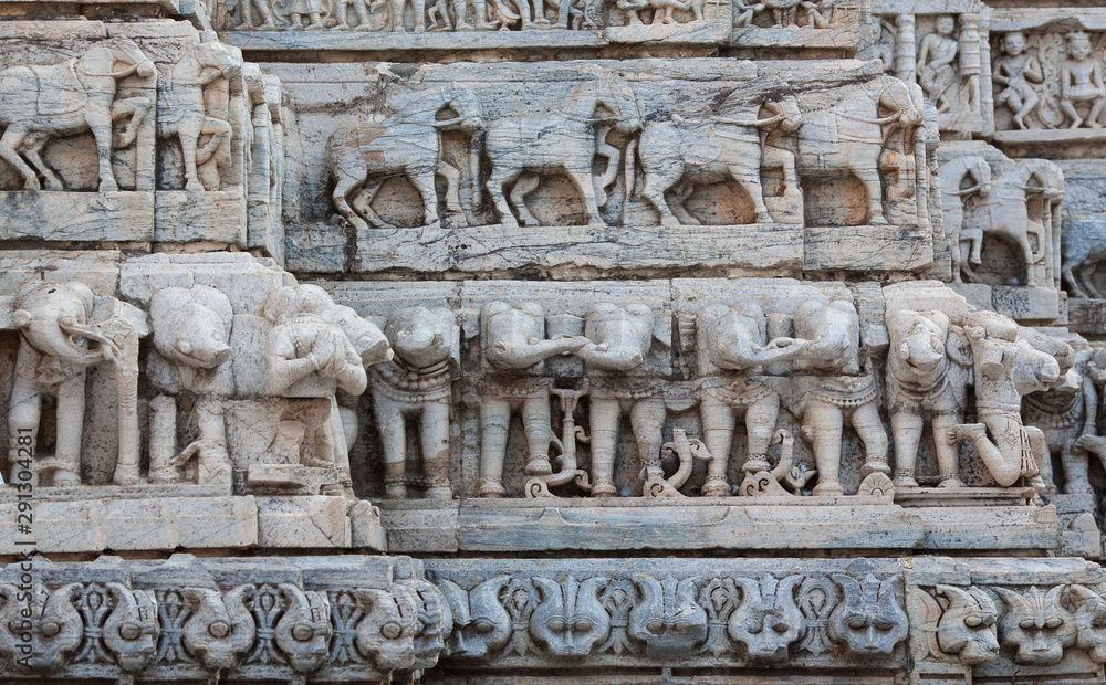 Fototapeta premium Bas-relief with Horses and Elephants at famous ancient Jagdish Temple in Udaipur, Rajasthan, India