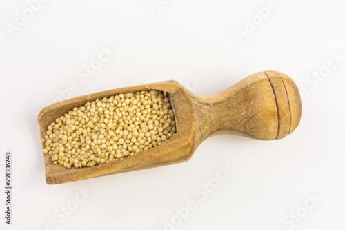 amaranth seeds on wooden scoop