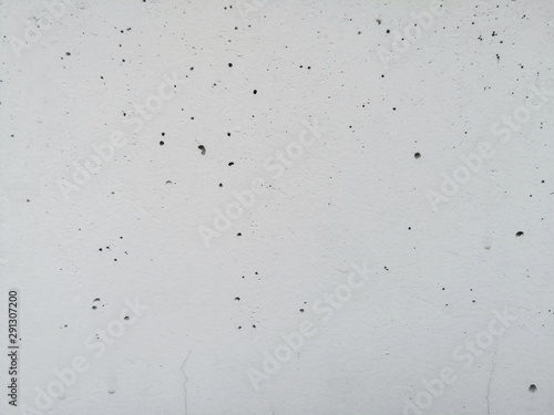 White concrete wall and air holes texture background. photo