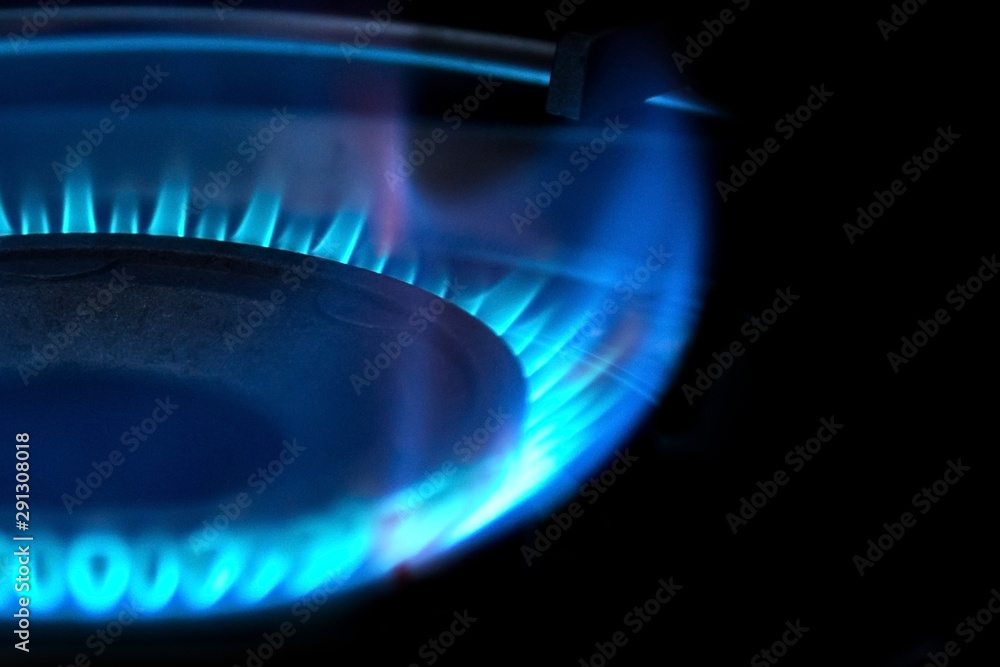 Flame of gas on kitchen stove. Selective focus. Flame of gas on kitchen stove. Selective focus.