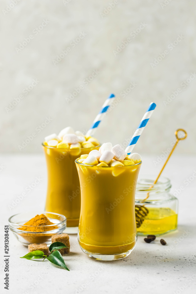 Turmeric marshmallow cinnamon hot drink. Selective focus, copy space. Turmeric marshmallow cinnamon hot drink. Selective focus, copy space.