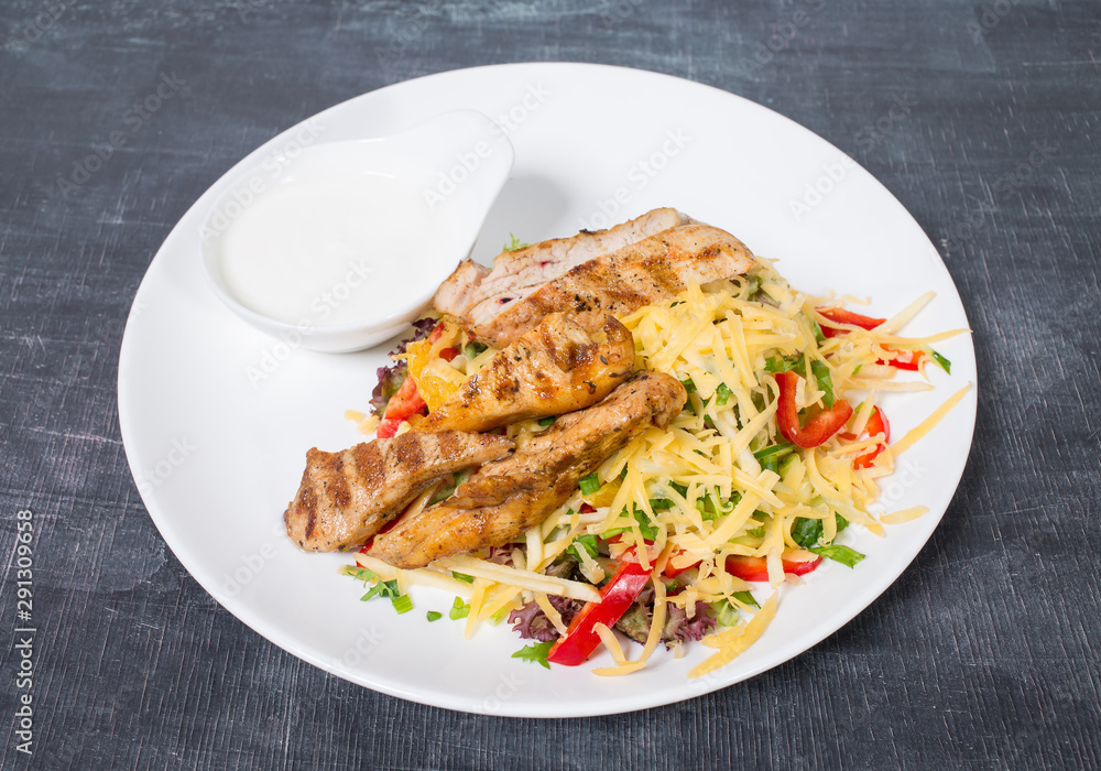 Delicious salad with cheese and chicken fillet. Delicious salad with cheese and chicken fillet.