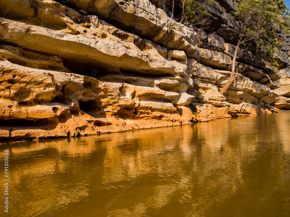 Fototapeta premium Impressive stone formations reflected on Manambolo river, Tsingy de Bemaraha Strict Nature Reserve, Madagascar
