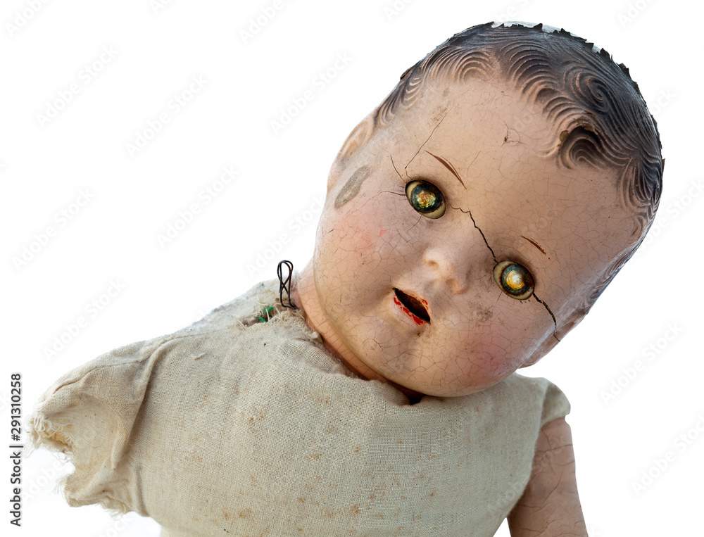Creepy old doll head with glowing evil eyes. Stock Photo Adobe Stock