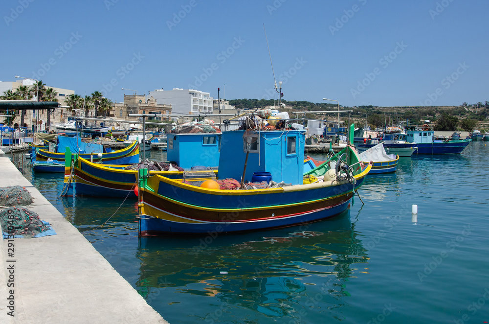 traditional fishing boats in the harbour of Marsaxlokk , Malta