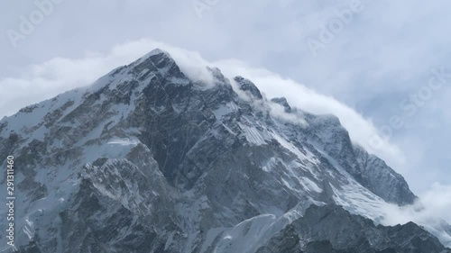 Majestic mountain motion time lapse close up of clouds running around Everest